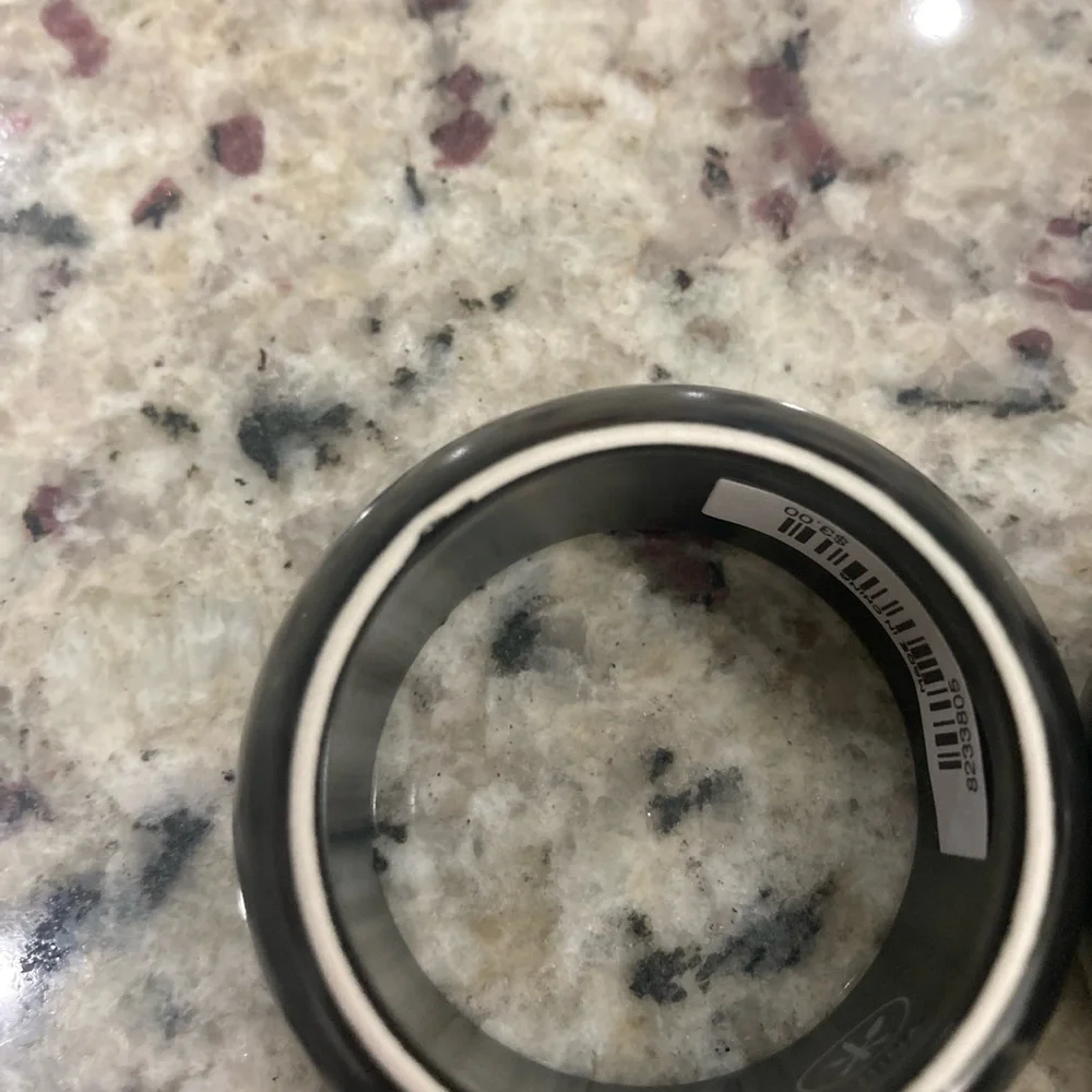 NWT Pier 1 Imports set of 4 black with white on one side ceramic napkin rings